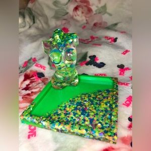 Handmade resin goddess jewelry tray in neon green with sparkly confetti